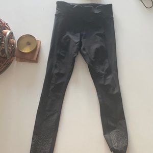Tight stuff right Lululemon size 4 legging. Scalloped bottom, reflective.